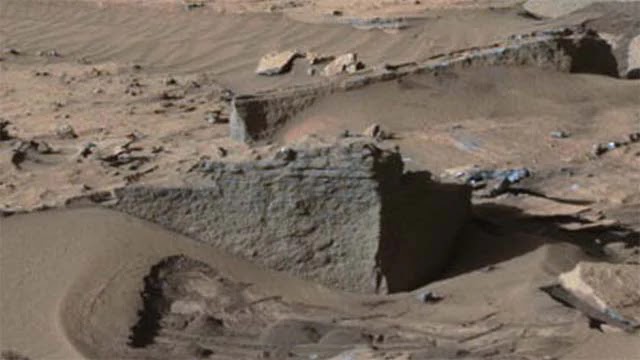 An image of the Curiosity Rover showing an alleged wall on Mars.